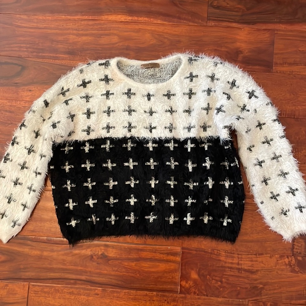 Fuzzy white and black sweater. Size M